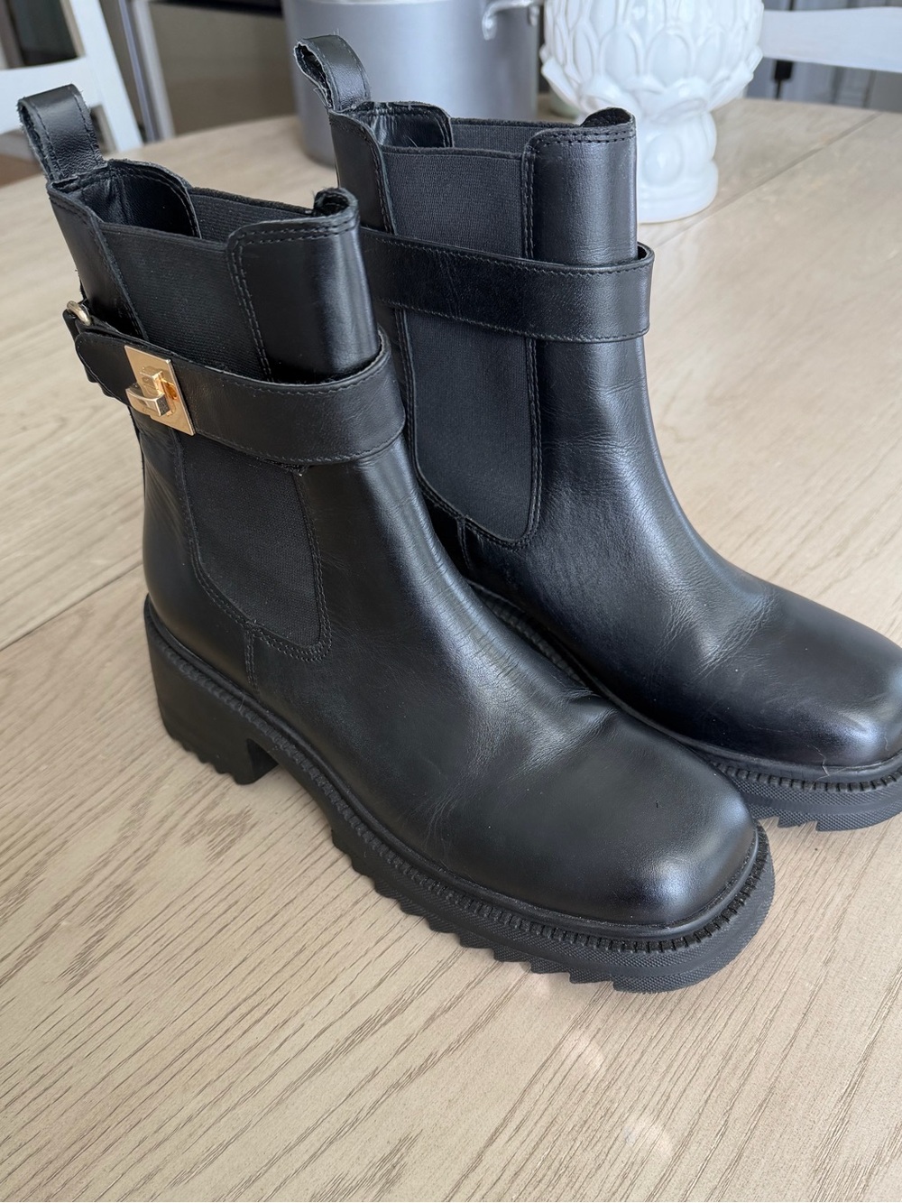 Steve Madden Black Leather Lug-Sole Chelsea Booties with Gold Accent